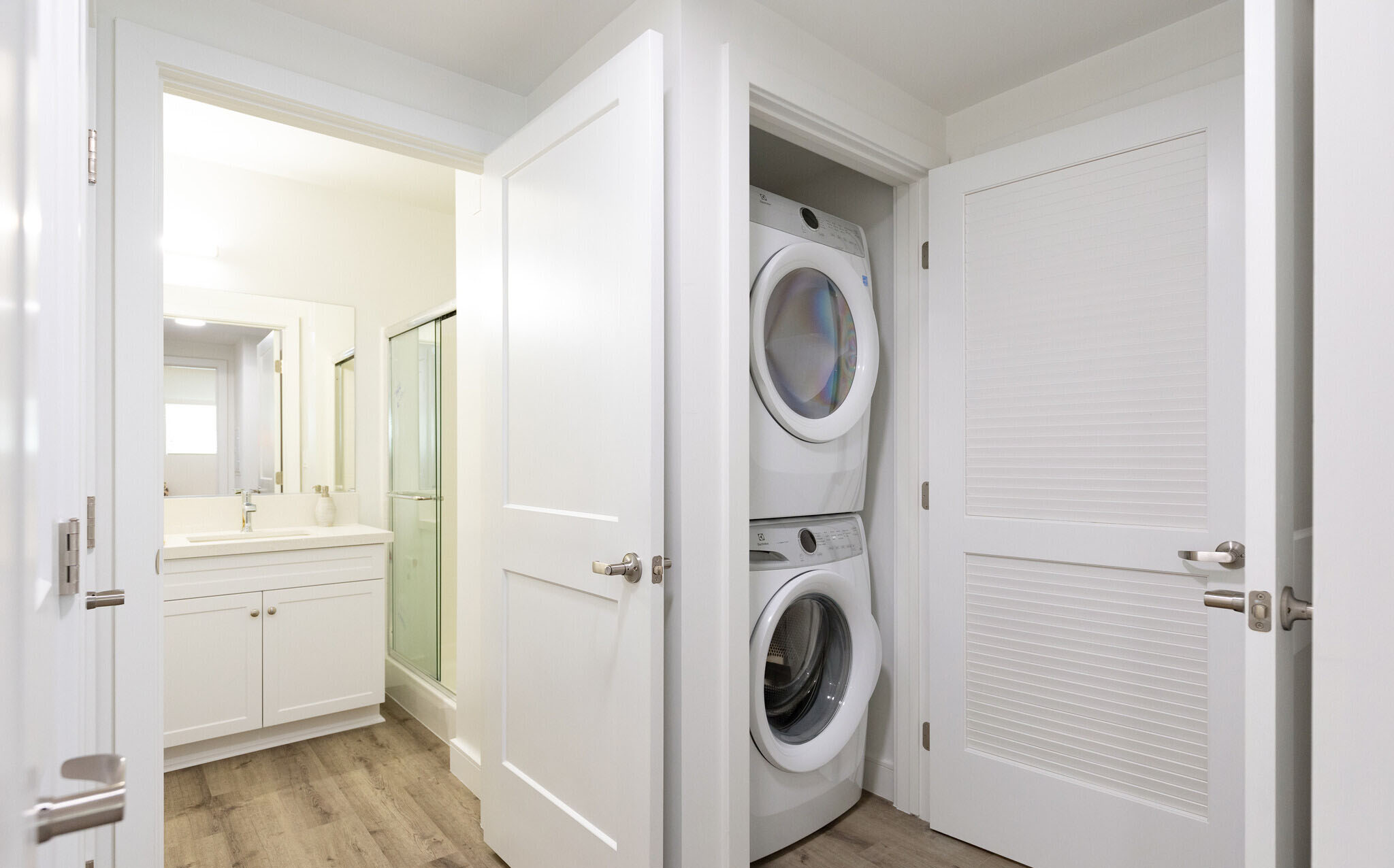 Picture of stacked washer and dryer in dedicated laundry closet.